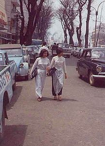 Typical street scene, Saigon. Women are wearing the traditional dress, the 'Ao Dai" pronounced 'OW JAI'. I understand this is rare today, except on formal occasions but it was quite common in 1970.