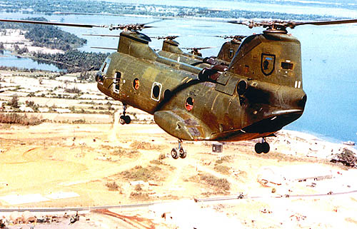 Left echelon, over KyHa, in 1967. KyHa was HMM-165's first base and was south of DaNang, on the coast. Note how beat up the birds are, even though they are less than a year old. No windows, the grunts knocked them out, nothing that didn't contribute to the mission. Copyright TOM MIX